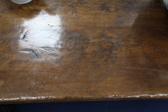 A large carved oak refectory table, 11ft 8in. x 2ft 11.5in. x 2ft 6.5in.